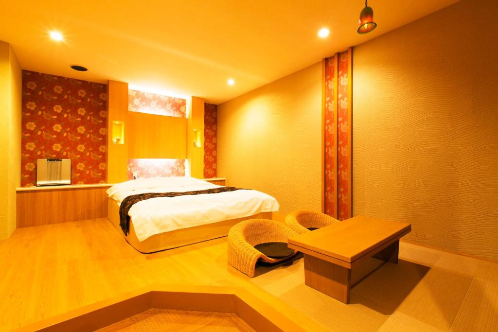 Postel nebo postele na pokoji v ubytování Hotel Atlantis Higashi Osaka (Adult Only)