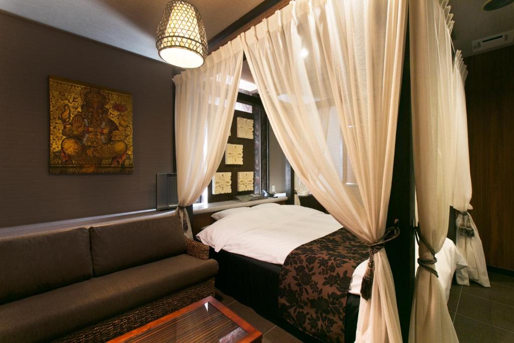 Postel nebo postele na pokoji v ubytování Hotel Atlantis Higashi Osaka (Adult Only)