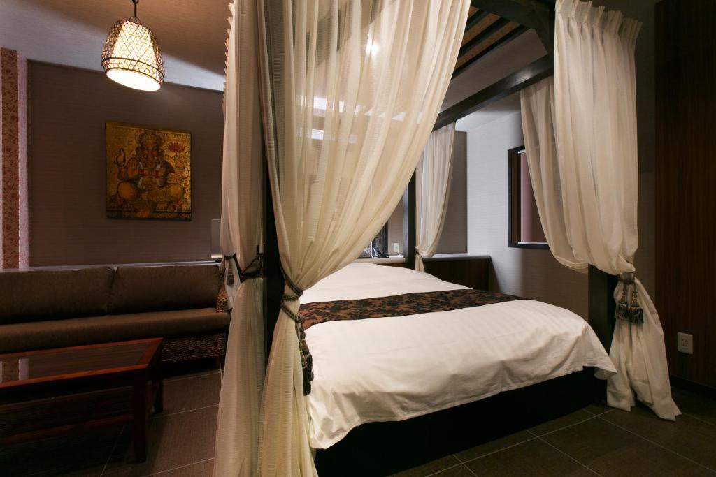 Postel nebo postele na pokoji v ubytování Hotel Atlantis Higashi Osaka (Adult Only)