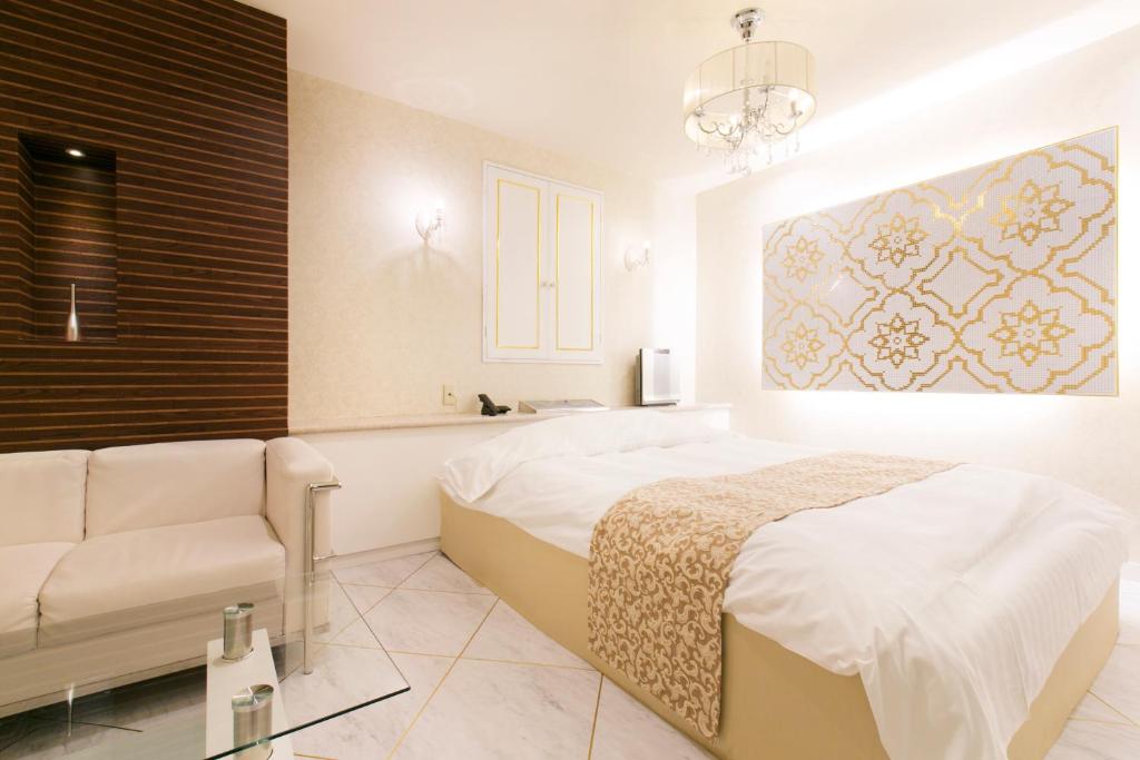 Postel nebo postele na pokoji v ubytování Hotel Atlantis Higashi Osaka (Adult Only)
