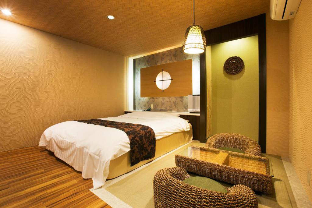 Postel nebo postele na pokoji v ubytování Hotel Atlantis Higashi Osaka (Adult Only)