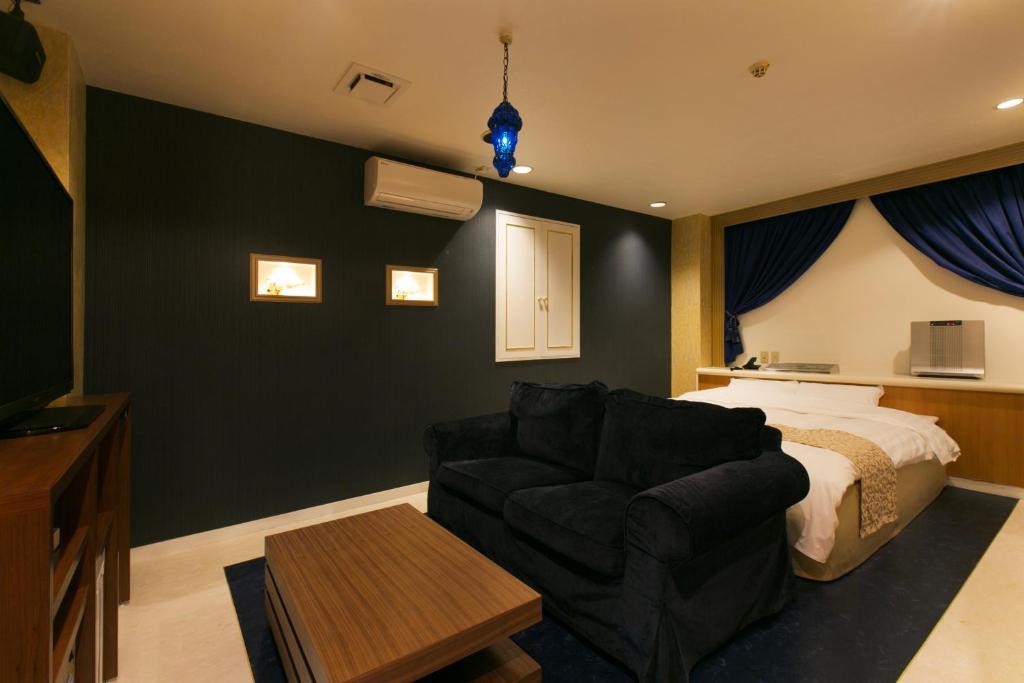 Postel nebo postele na pokoji v ubytování Hotel Atlantis Higashi Osaka (Adult Only)