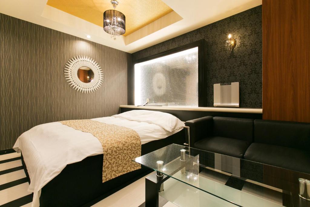 Postel nebo postele na pokoji v ubytování Hotel Atlantis Higashi Osaka (Adult Only)
