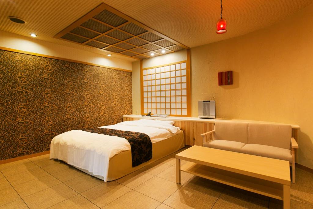 Postel nebo postele na pokoji v ubytování Hotel Atlantis Higashi Osaka (Adult Only)