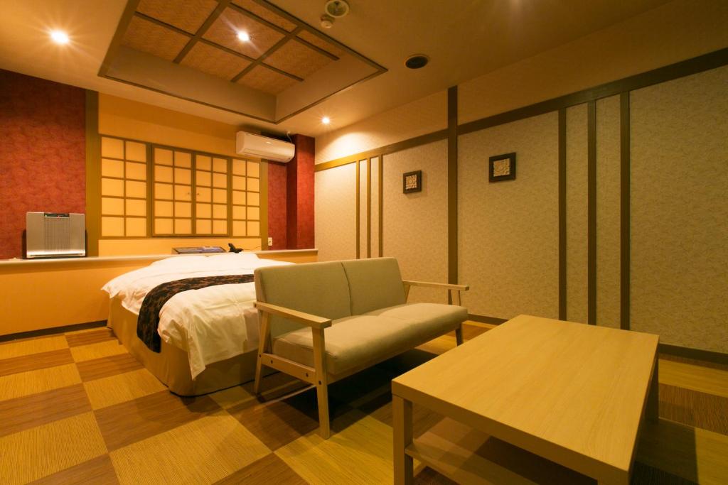 Postel nebo postele na pokoji v ubytování Hotel Atlantis Higashi Osaka (Adult Only)