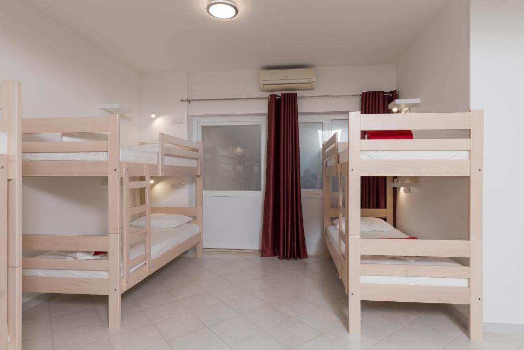Postel nebo postele na pokoji v ubytování Hostel Free Bird