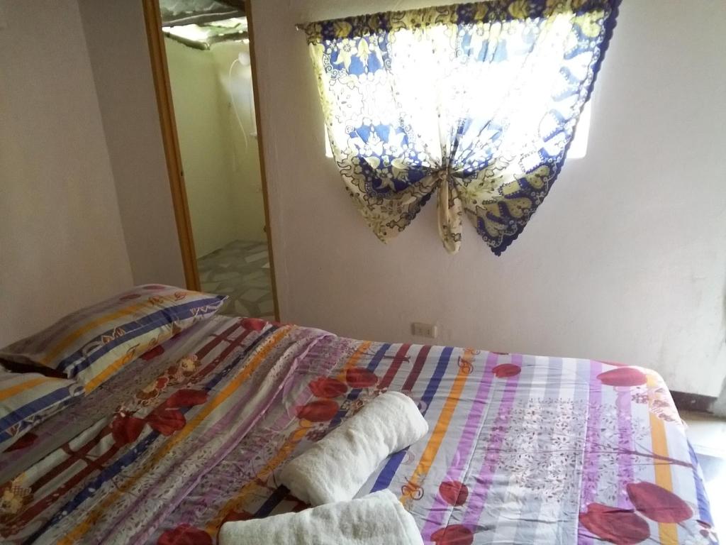 Una cama o camas en una habitación de Overview Hostel