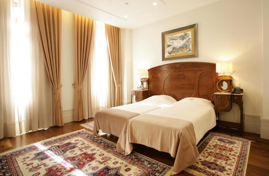 Postel nebo postele na pokoji v ubytování Hotel Ibn-Arrik