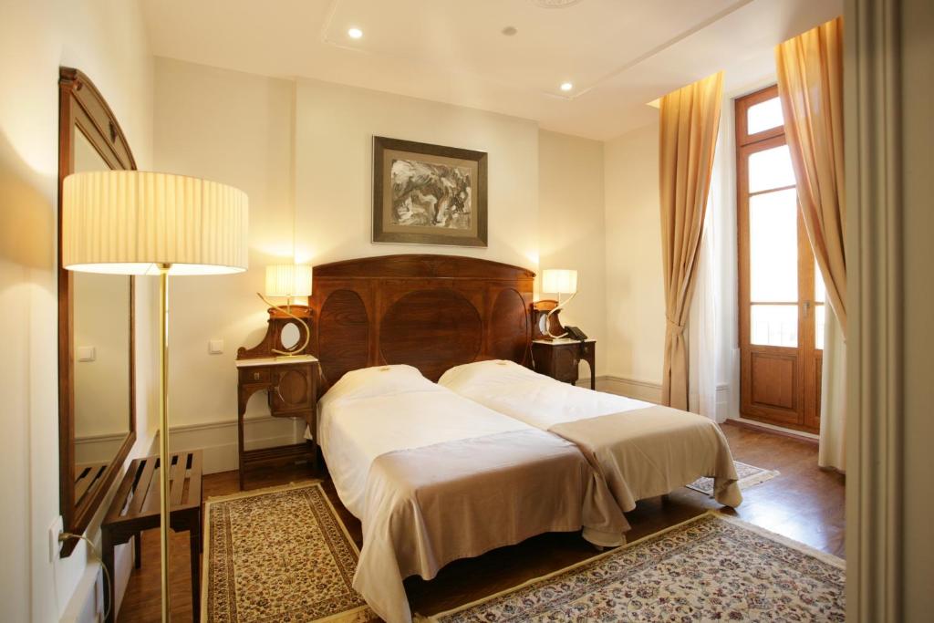 Postel nebo postele na pokoji v ubytování Hotel Ibn-Arrik