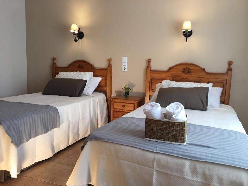 Postel nebo postele na pokoji v ubytování Hostal El Paso