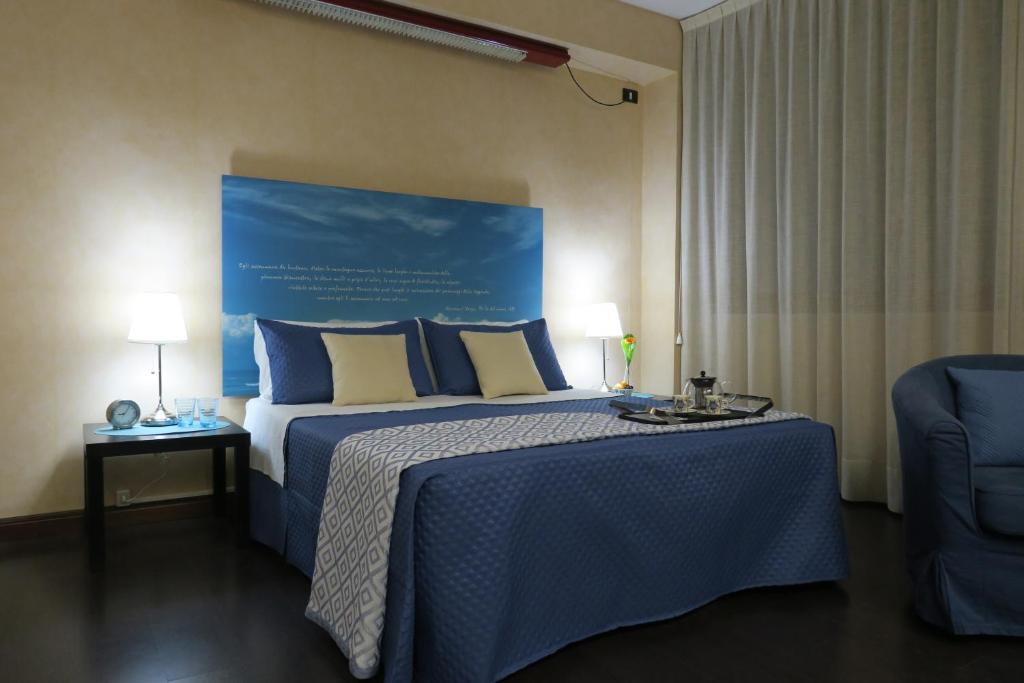 Postel nebo postele na pokoji v ubytování Mare Nostrum Petit Hôtel