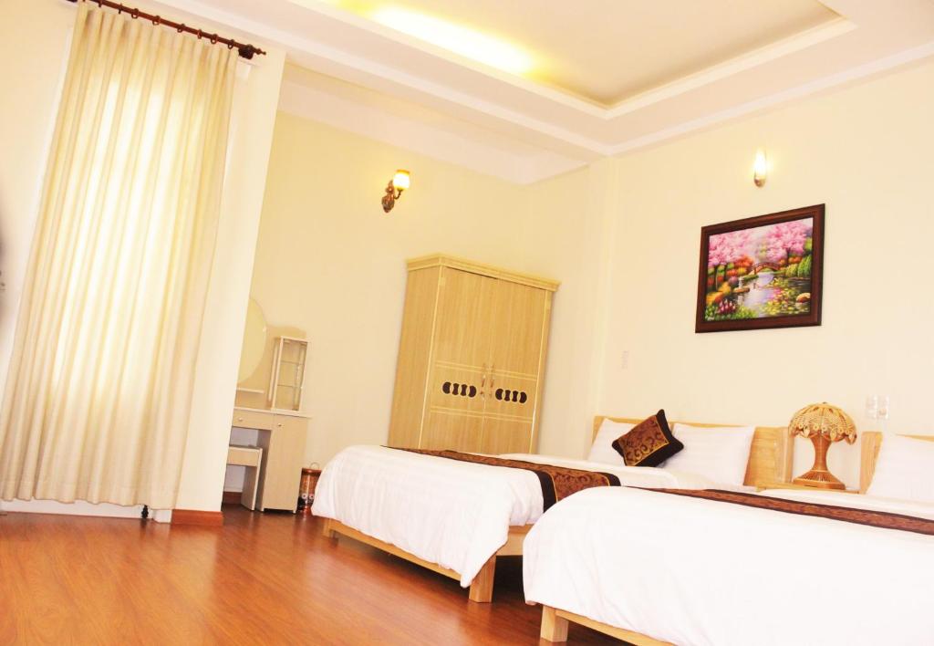 Postel nebo postele na pokoji v ubytování Thien Phu Guesthouse Dalat