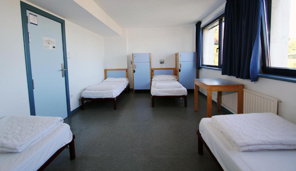 Postel nebo postele na pokoji v ubytování Bilbao Hostel