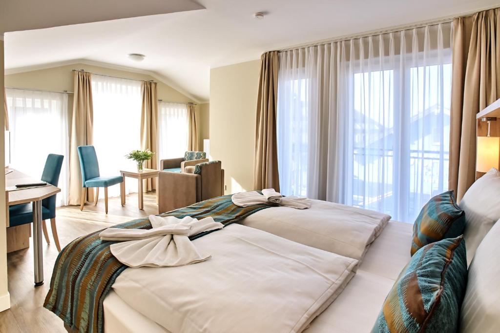 Postel nebo postele na pokoji v ubytování AKZENT Apartmenthotel Residenz