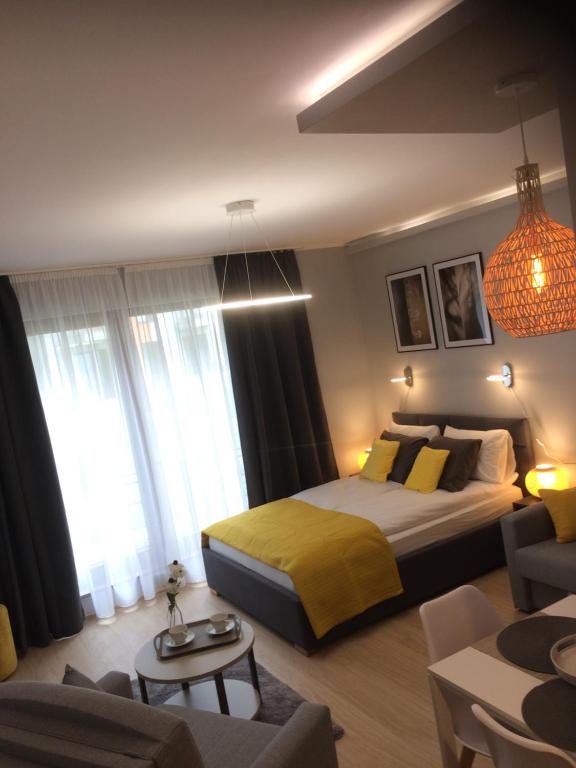Posteľ alebo postele v izbe v ubytovaní Apartament Nowa Motława & SPA