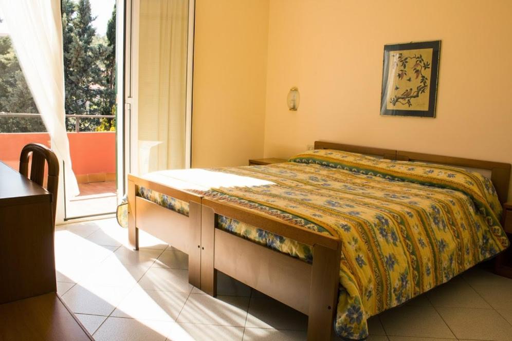 Llit o llits en una habitació de Hotel La Margherita
