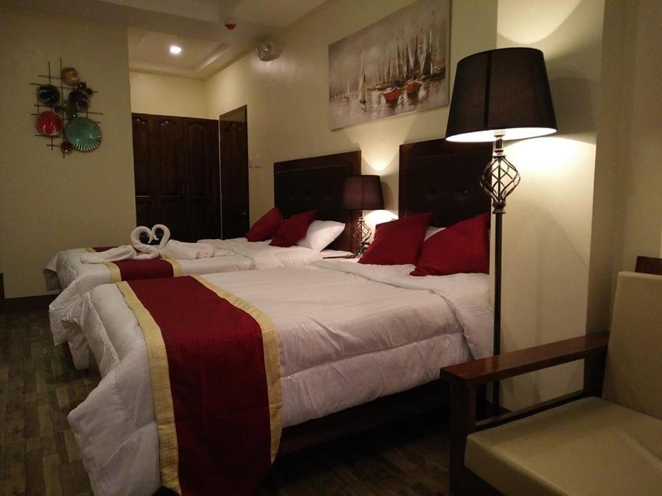 Postel nebo postele na pokoji v ubytování Hotel Maefinn