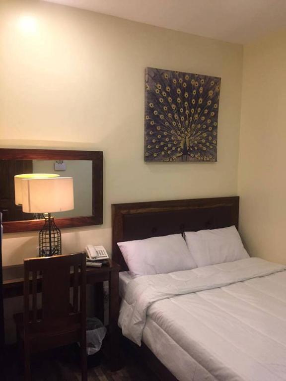 Postel nebo postele na pokoji v ubytování Hotel Maefinn