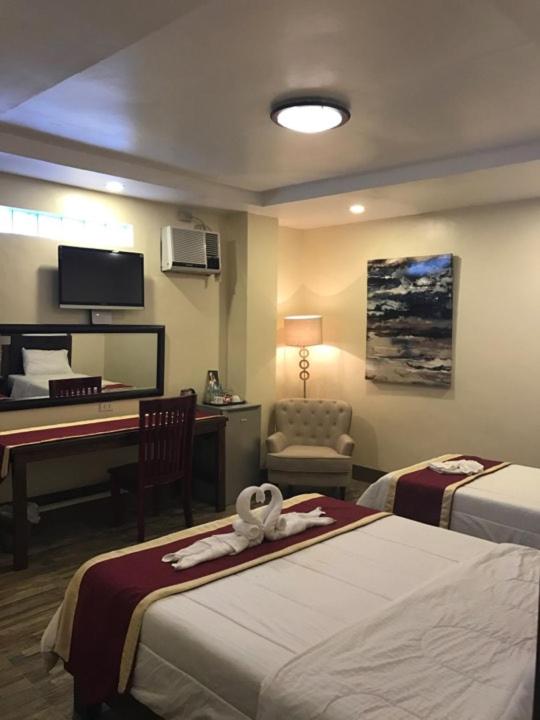 Postel nebo postele na pokoji v ubytování Hotel Maefinn