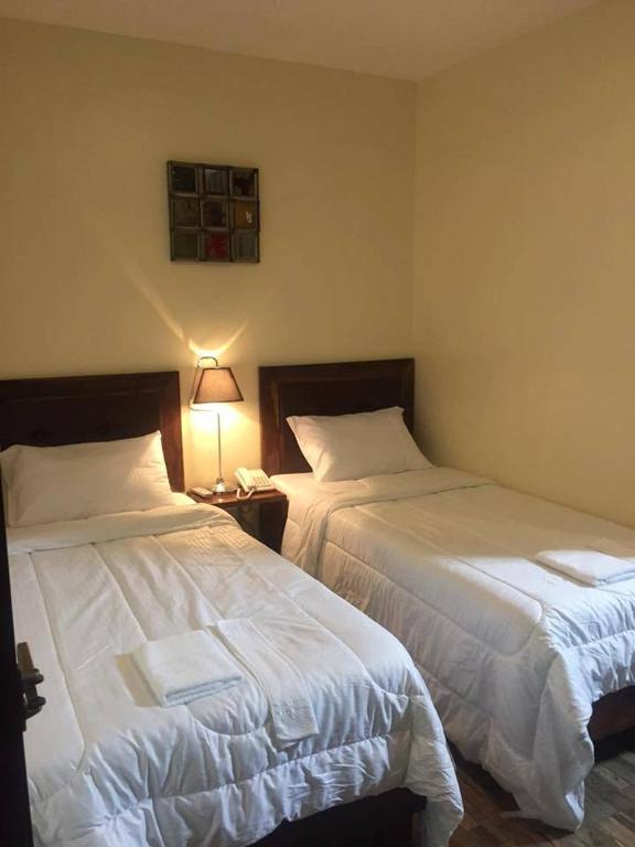 Postel nebo postele na pokoji v ubytování Hotel Maefinn