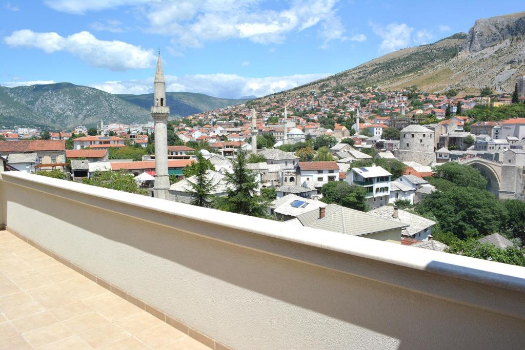a view of a city from a balcony at Apartments Kapetanovina in Mostar
