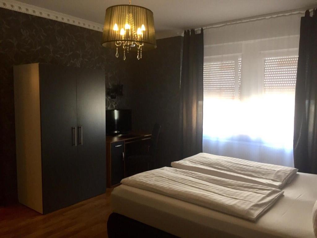 Postel nebo postele na pokoji v ubytování Hotel Monte Cristo