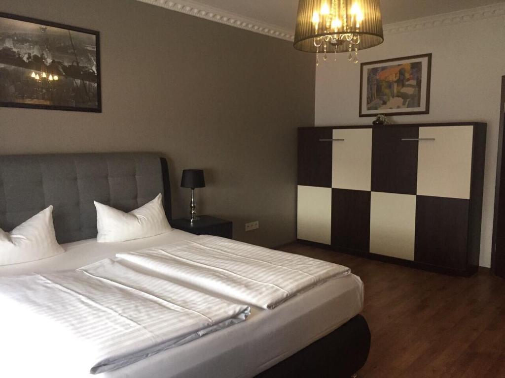 Postel nebo postele na pokoji v ubytování Hotel Monte Cristo