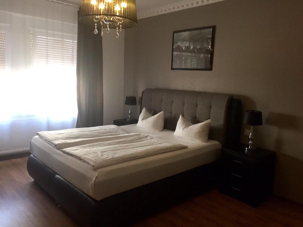 Postel nebo postele na pokoji v ubytování Hotel Monte Cristo
