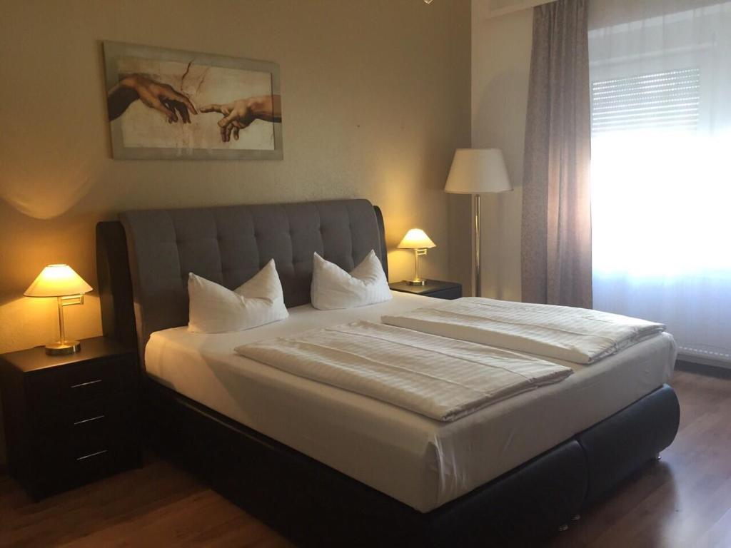 Postel nebo postele na pokoji v ubytování Hotel Monte Cristo