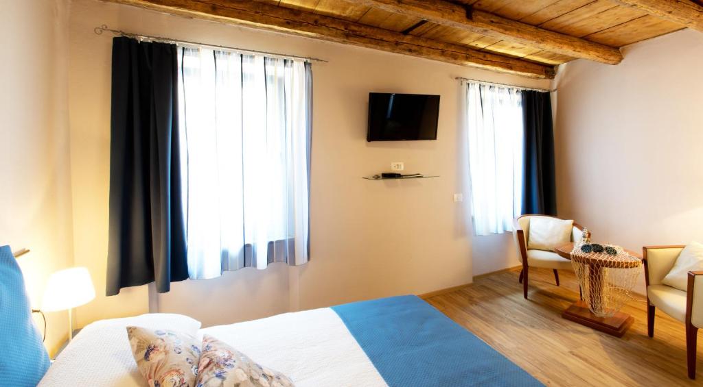 TV a/nebo společenská místnost v ubytování Guesthouse Centrum B&B