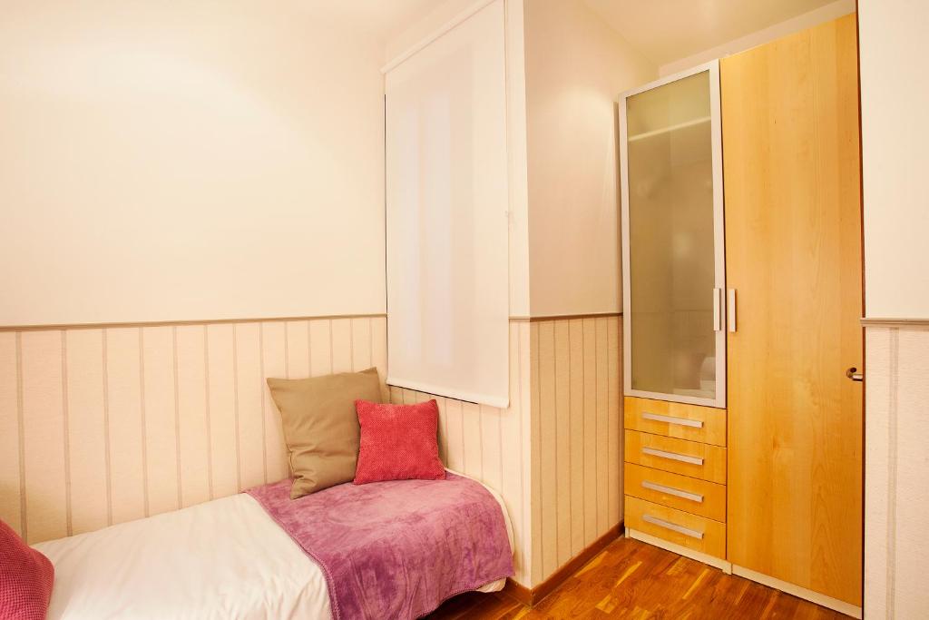 Posteľ alebo postele v izbe v ubytovaní Apartments Barcelona & Home Deco Viladomat