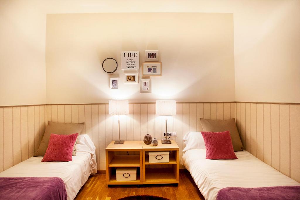 Posteľ alebo postele v izbe v ubytovaní Apartments Barcelona & Home Deco Viladomat