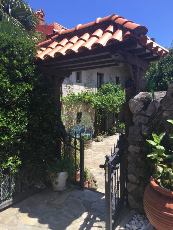an entrance to a house with a gate and a fence at Posada Soano in Soano