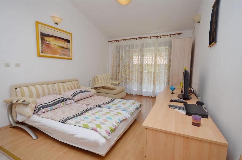 Posteľ alebo postele v izbe v ubytovaní Apartments Miroslava