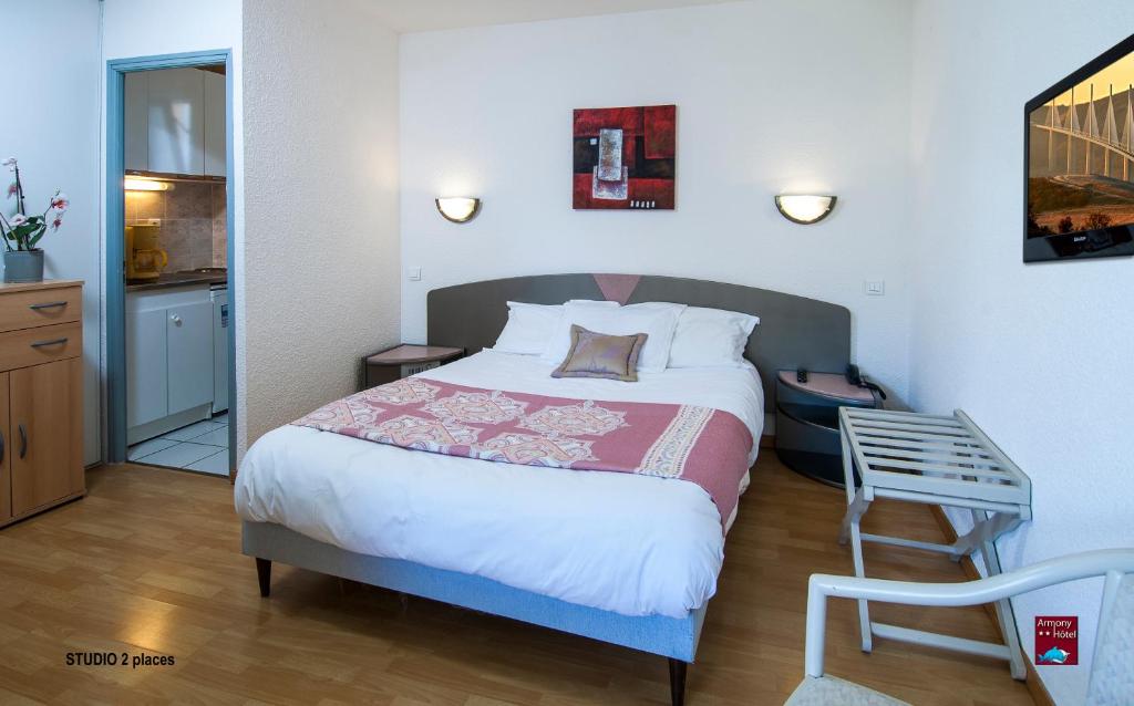 Postel nebo postele na pokoji v ubytování Hôtel Armony