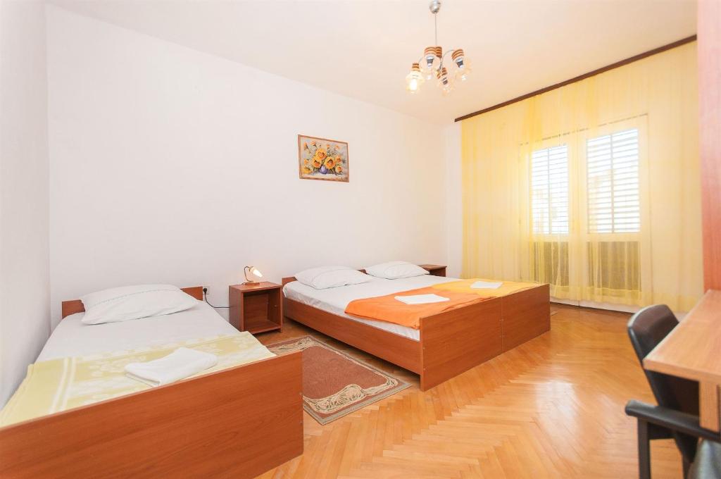 Postel nebo postele na pokoji v ubytování Apartment Slavko