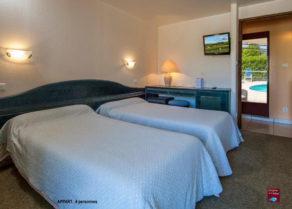 Postel nebo postele na pokoji v ubytování Hôtel Armony