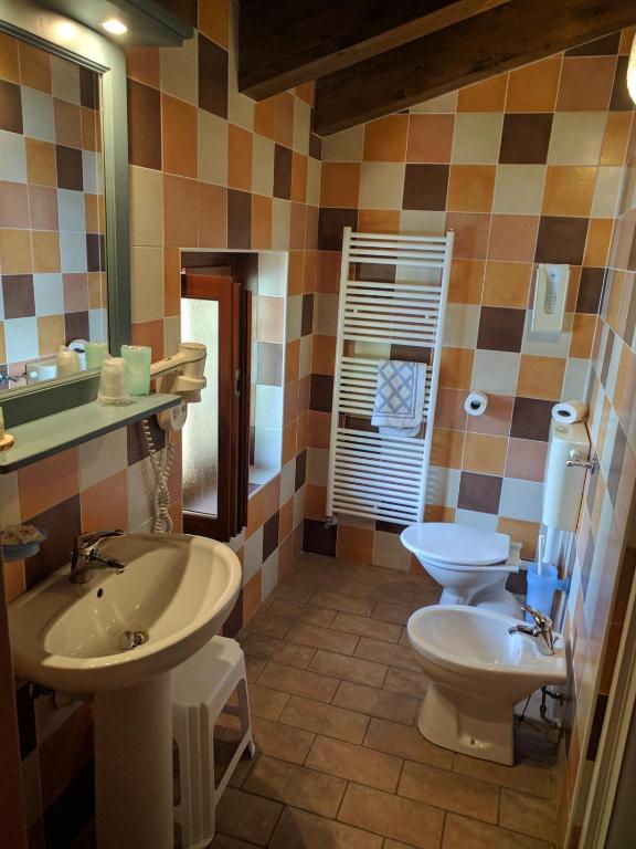 Koupelna v ubytování Hotel Piccolo Parco
