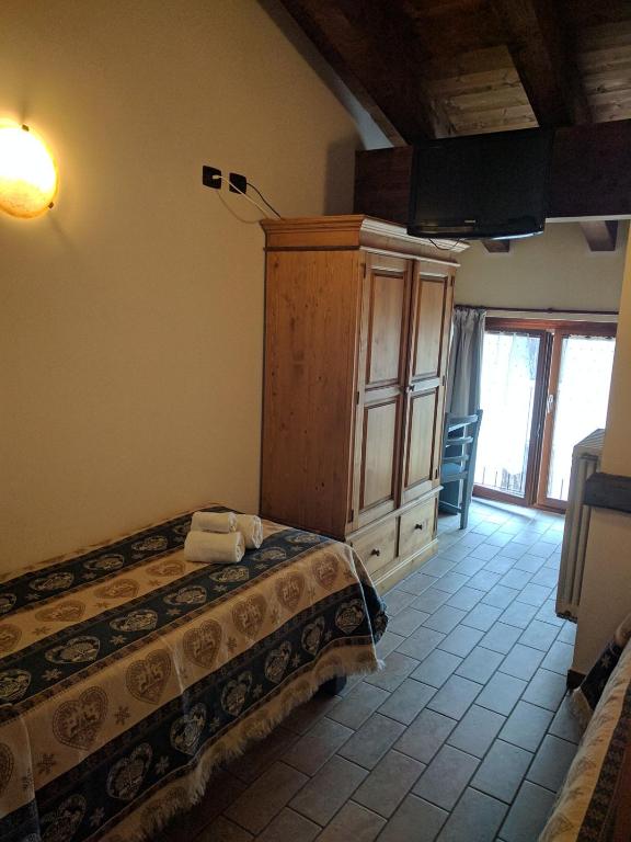 Postel nebo postele na pokoji v ubytování Hotel Piccolo Parco
