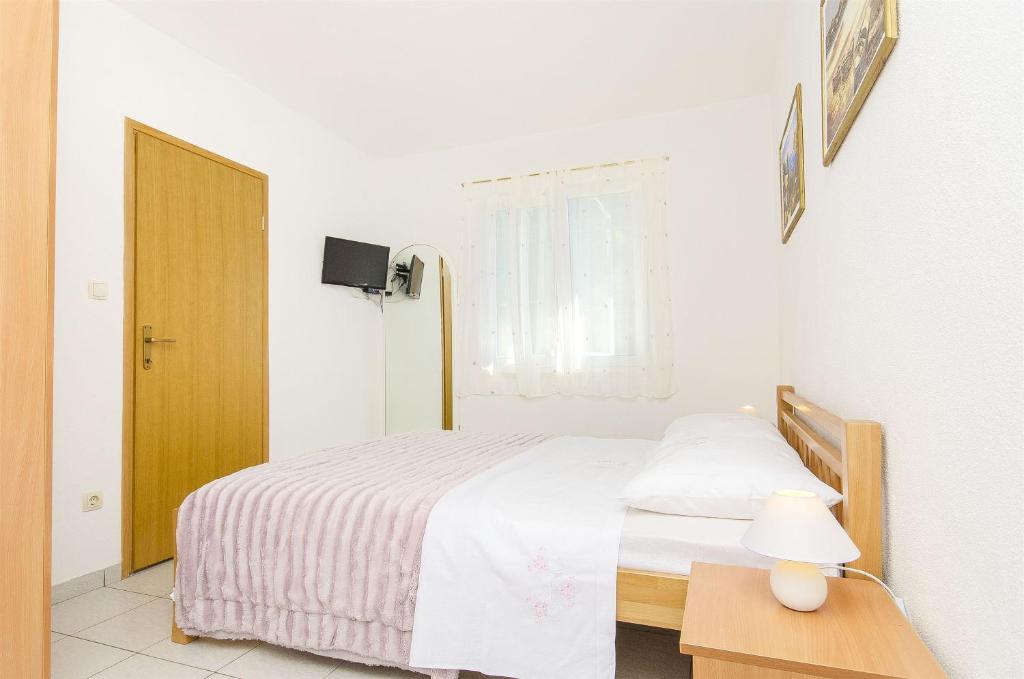 Postel nebo postele na pokoji v ubytování Apartment Antonio