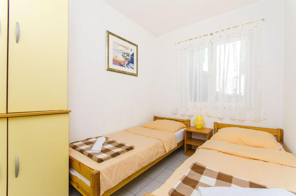 Postel nebo postele na pokoji v ubytování Apartment Antonio