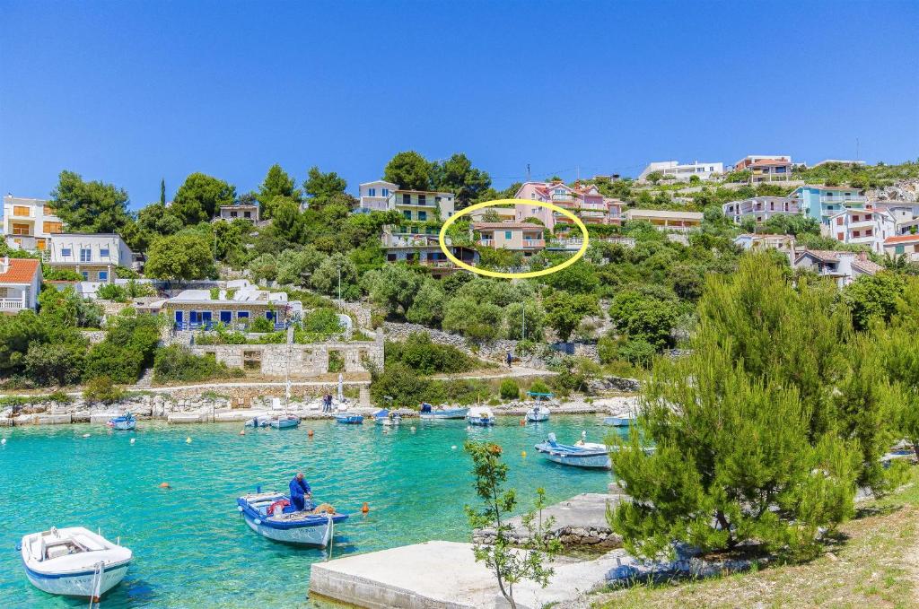 a group of boats in a body of water at Apartments Otjana in Sevid