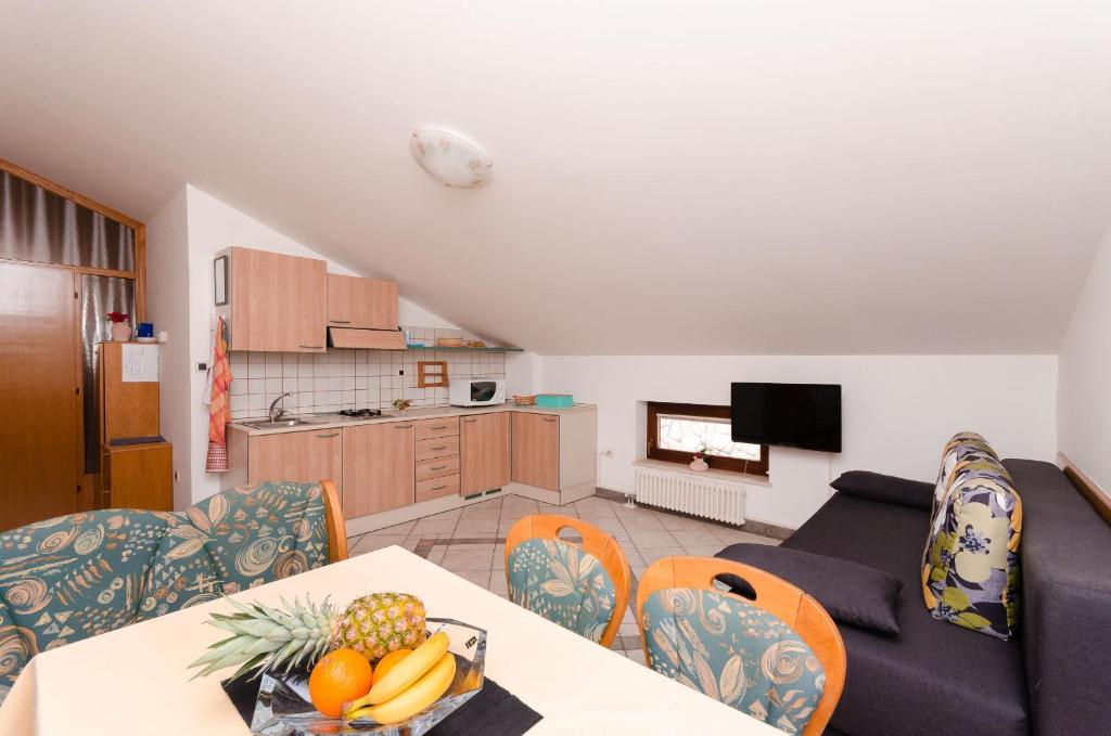 Kuchyň nebo kuchyňský kout v ubytování Apartments Milan