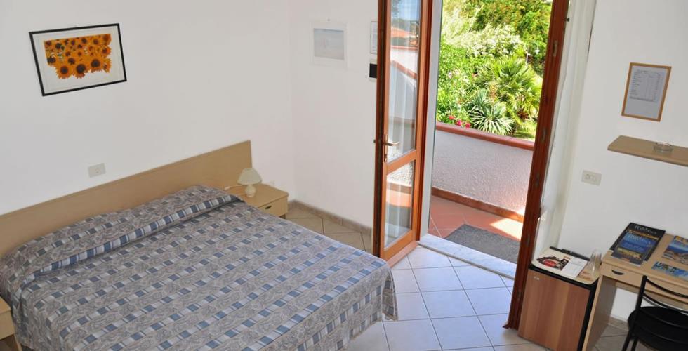 Postel nebo postele na pokoji v ubytování Villa dei Limoni