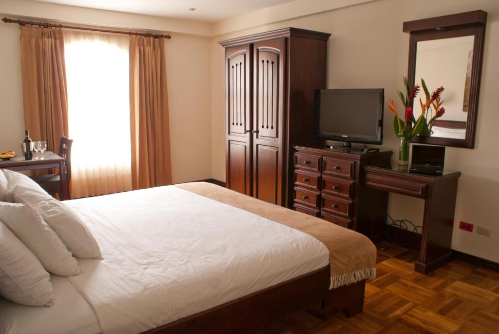 Postel nebo postele na pokoji v ubytování Hotel Plaza Real Suites & Apartments San Jose