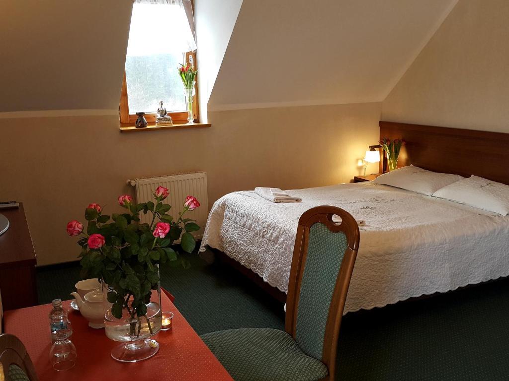 Postel nebo postele na pokoji v ubytování Zajazd Byczy Róg