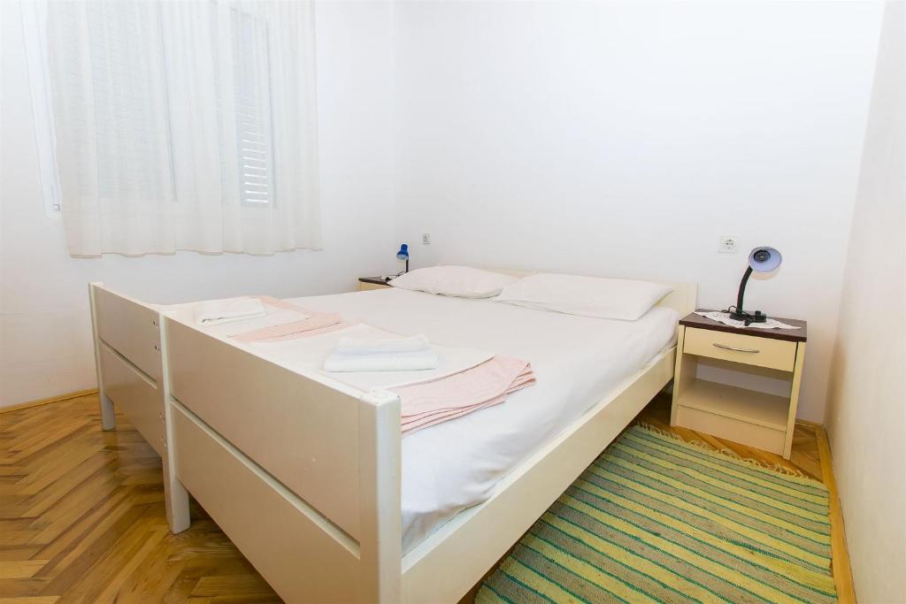 Cama ou camas em um quarto em Apartment Tina