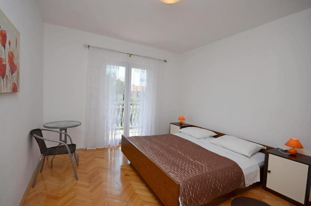 Postel nebo postele na pokoji v ubytování Apartment Ana