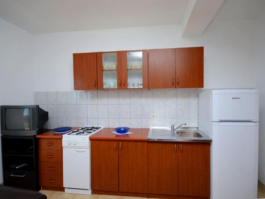 Kuchyň nebo kuchyňský kout v ubytování Apartments Marijo