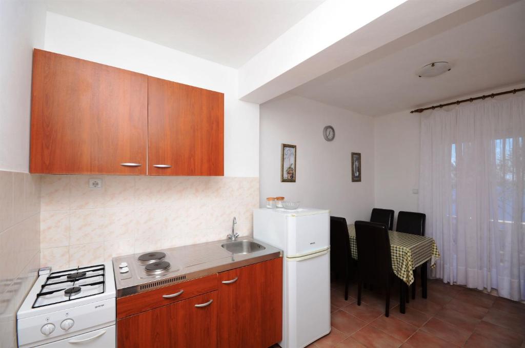 Kuchyň nebo kuchyňský kout v ubytování Apartments Marijo